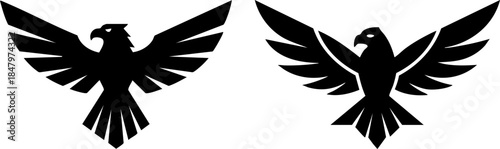 Two distinct black silhouette eagle logos with wings spread for corporate identity Vector