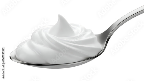 Spoonful of creamy white yogurt or whipped cream dessert