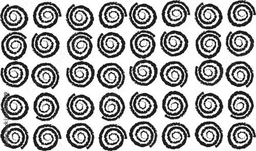 Black and white image of repeating spiral patterns
