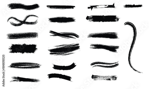 Collection of black brush strokes and marks on white background