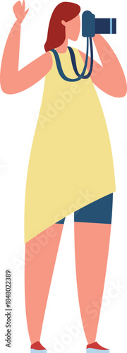 Woman photographing a scene with digital camera