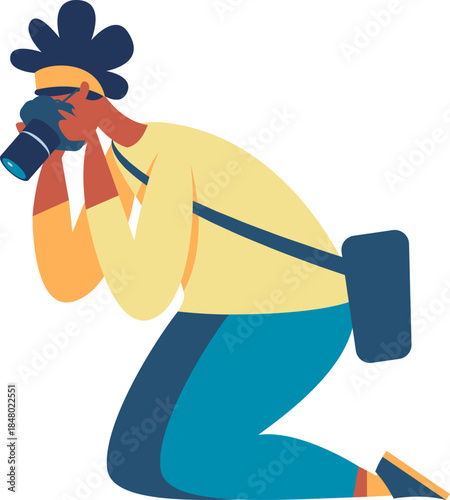 Photographer kneeling taking picture with camera