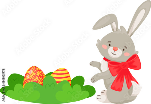 Easter bunny finding colorful eggs in green grass