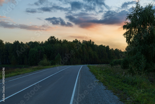 A road with a sunset in the background