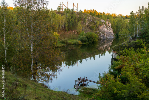 pond in the forest between the rocks