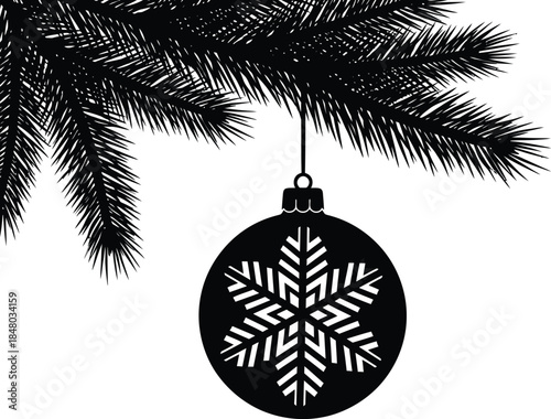 Black and white snowflake ornament hanging from a pine branch with sharp needles