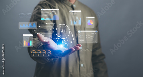 concept of artificial intelligence and data analysis, businessman demonstrates virtual interface of graph and holographic AI brain on hand, conveying future technology and intelligent work assistants