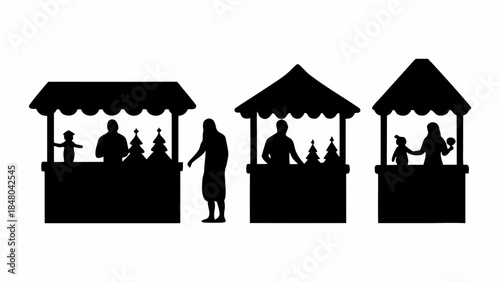 Silhouettes of people at Christmas market stalls selling trees