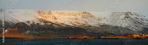 Iceland panorama of sunlit mountain