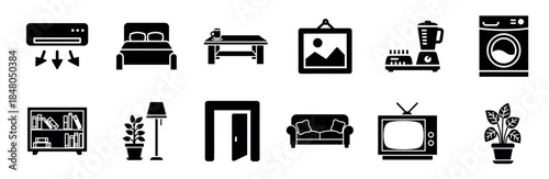 Set of black solid glyph icons representing household furniture, home appliances, and interior decor elements like a bed, sofa, and lamp in a minimalist vector style
