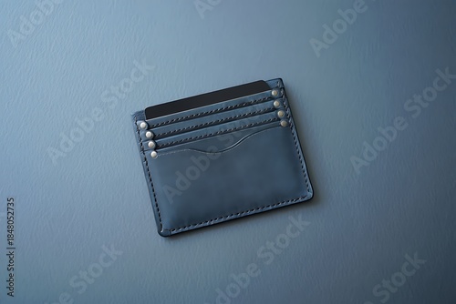 Slim black leather cardholder wallet with silver stitching details
