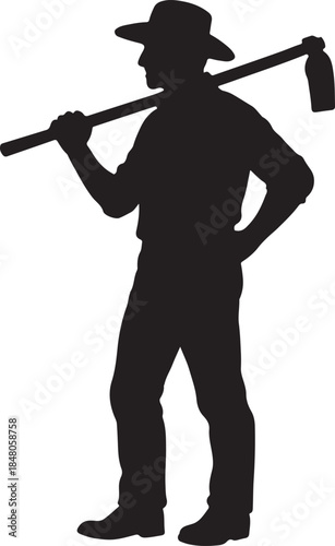 Silhouette of a hardworking farmer carrying a hoe over his shoulder