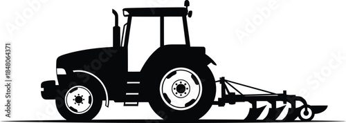 Tractor plowing field