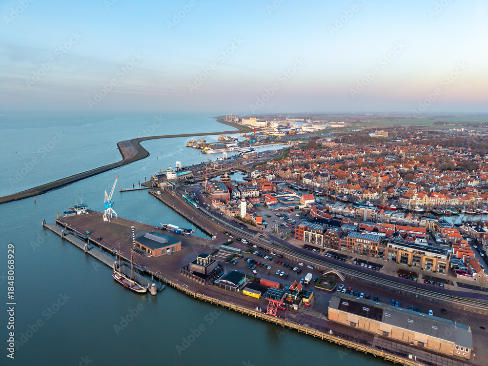 Obraz premium Aerial drone view of Harlingen city centre and harbour at sunset 