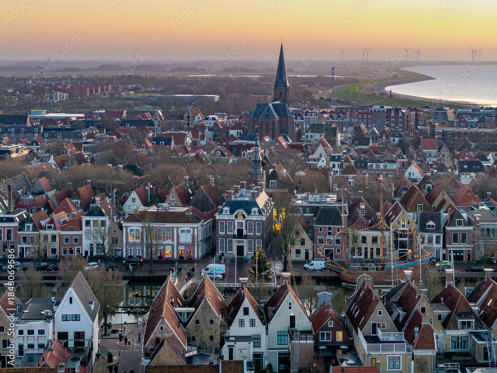 Naklejka premium Aerial drone view of Harlingen historic town at sunset