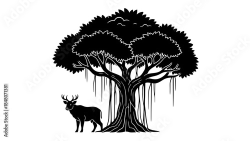Silhouette of majestic banyan tree with hanging roots and a deer standing beside it.