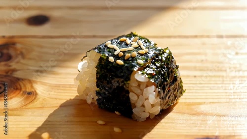 Delicious Japanese Onigiri Rice Ball with Nori Seaweed and Sesame Seeds.