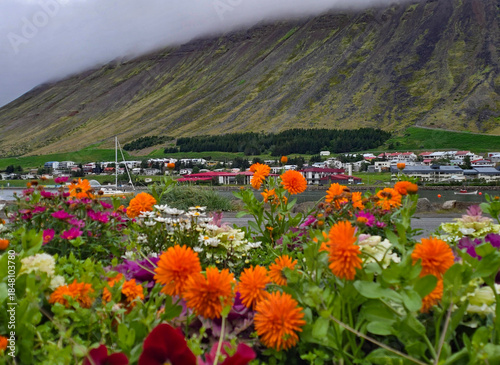 Beautiful view of the small town of Ísafjörður and the wonderful fjord behind it with high mountains 