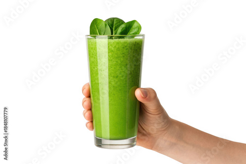 Hand holding a tall glass of green smoothie with basil leaves isolated on transparent background