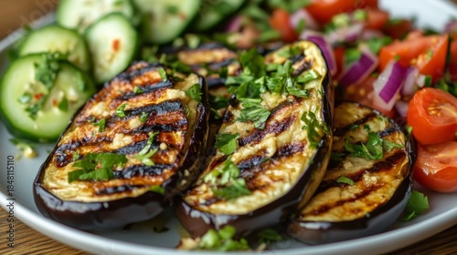 Grilled eggplant with a tahini drizzle, served with a cucumber and tomato salad. --ar 16:9 --v 6.1 Job ID: 55e576d6-0ae5-4e12-b89b-2dd069f2d390