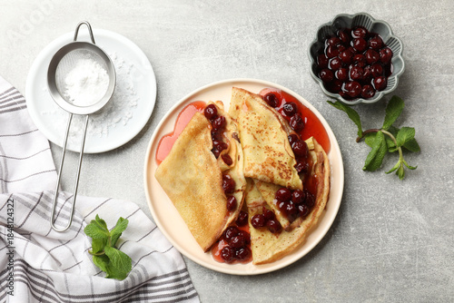 Schilderij op canvas Tasty crepes with cherries, jam and mint served on light table, flat lay
