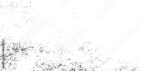 An abstract grunge background featuring black ink splashes and wet paint drops on a dirty textured paper surface with a weathered film window glass pattern