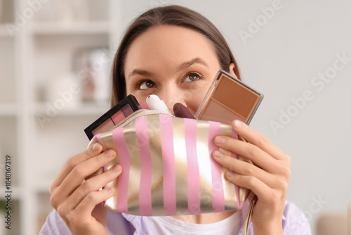 Young woman with cosmetic b...