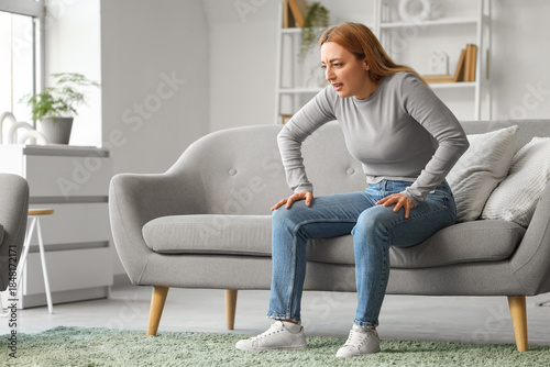 Angry mature woman sitting ...