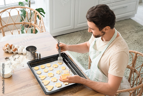 Young man preparing cookies...
