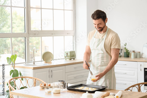 Young man preparing cookies...