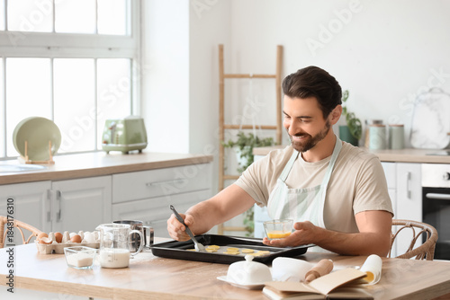 Young man preparing cookies...