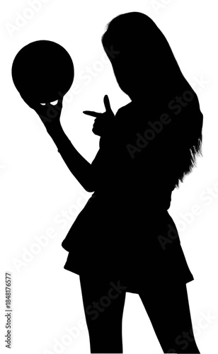 Young woman holding a soccer ball, looking at the camera.