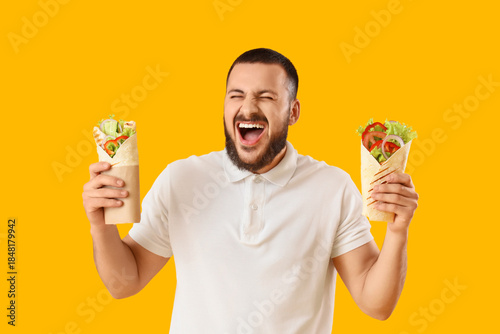 Happy young man with tasty ...