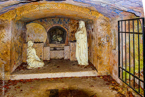 Statues depicting the burial of Jesus, Mary accompanies the body of Jesus to his tomb, park with representations of seven sorrows of Mary, sunny day in Averbode, Scherpenheuvel-Zichem, Belgium