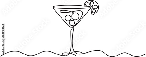 Continuous line drawing of a martini cocktail glass with olives and a lemon slice