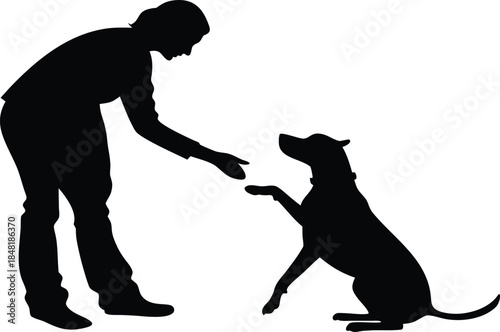 Woman and dog sharing a tender moment in silhouette