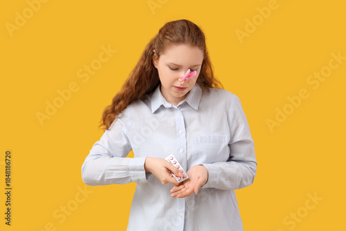 Ill young woman with clothe...