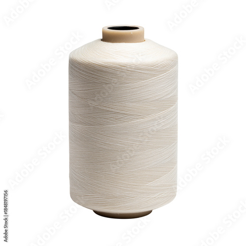 Thread Spool With White Thread on a Wooden Surface Showcasing a Simple Sewing...