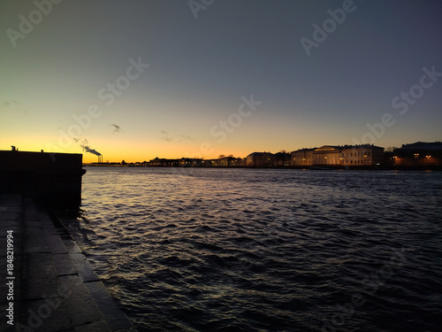 Sunset over the river with city skyline in view