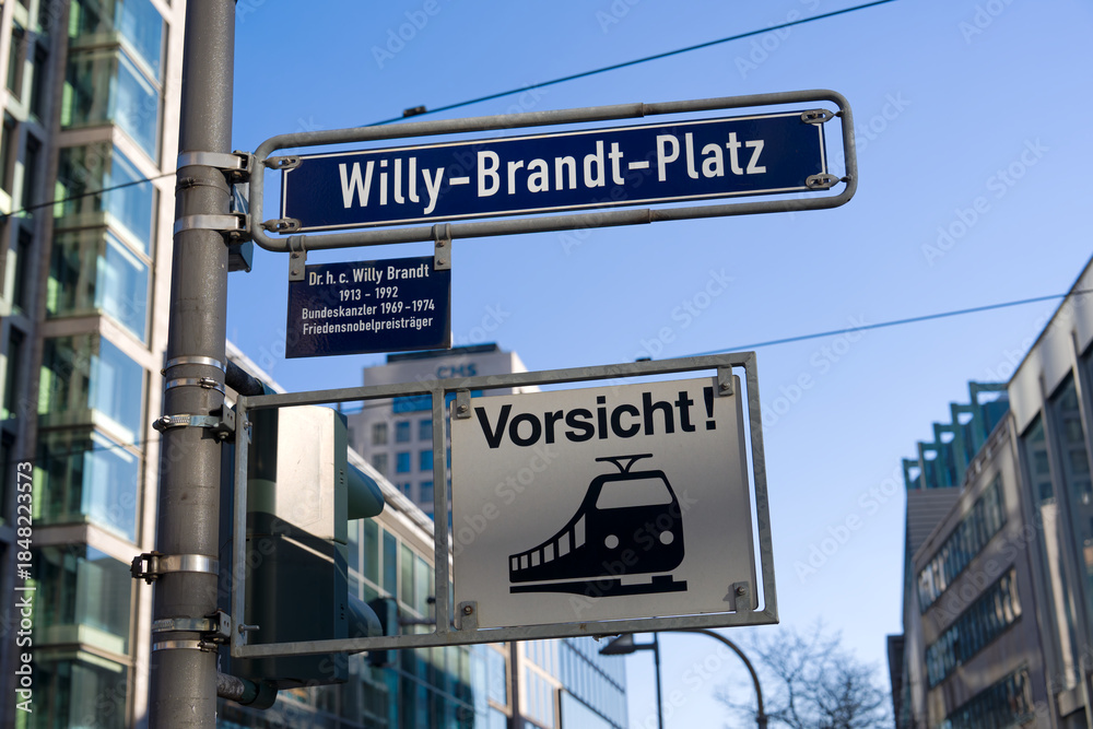 Fototapeta premium Willy Brand Square street name sign at downtown of German city of Frankfurt on a sunny autumn day. Photo taken November 22nd, 2025, Frankfurt am Main, Germany.