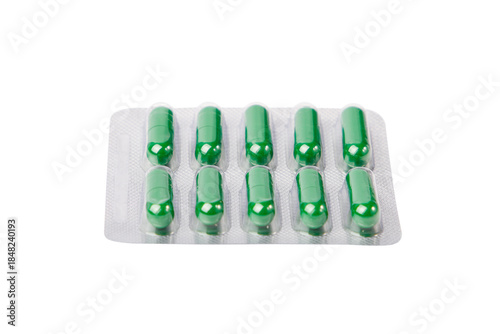 Green pills in blister pack isolated on white background. Clipping path