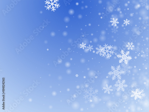 White heavy snowflakes design. Snowfall dust frozen shapes. Snowfall sky white blue wallpaper. Blurred snowflakes february theme. Snow nature scenery.
