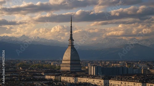 A breathtaking panoramic vista captures an expansive city nestled beneath a majestic, intricately designed tall building featuring a prominent dome and an elegant spire reaching towards the sky. In th