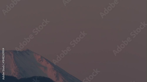 Tokyo,Japan  - December 18, 2025: Snow covered peak of Mt Fuji at sunrise