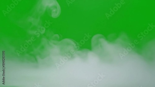 Foggy mountain peaks emerging from cloudscape with thin layer of ground fog effect green screen fog layer subtle style featuring fog,