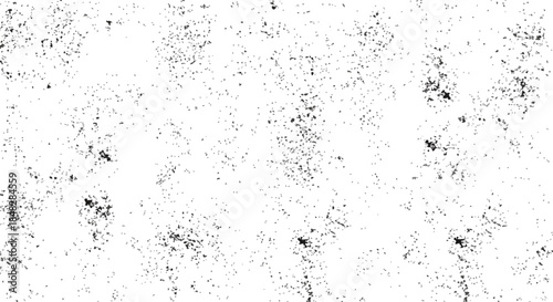 Seamless distressed texture with scattered dark particles and speckles on a white background, for grunge design elements.