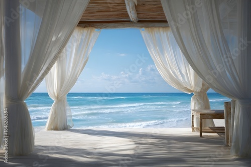 Beach cabana with flowing white curtains and ocean backdrop creating perfect retreat