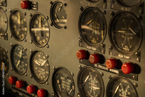 Fotografie Close-up view of vintage aircraft cockpit instrument panel with various gauges and dials