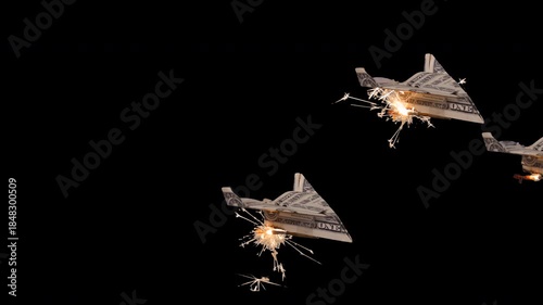 Flying US dollar paper airplanes with sparkler rockets and clear alpha channel background.