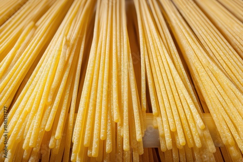 Long, uncooked pasta strand...